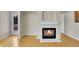 Living room featuring a fireplace and hardwood floors at 11268 Grove St # I, Westminster, CO 80031