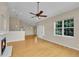 Bright living room with vaulted ceilings, hardwood floors, and a fireplace at 11268 Grove St # I, Westminster, CO 80031