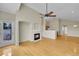 Spacious living room with a fireplace, hardwood floors, and access to outdoor patio at 11268 Grove St # I, Westminster, CO 80031