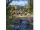 Secluded home exterior backing to babbling creek and mature evergreens at 100 River Park Dr # A, Breckenridge, CO 80424