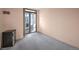 Simple bedroom with balcony access and wall-mounted wine cooler at 1551 Larimer St # 2805, Denver, CO 80202