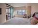 Spacious bedroom with city views and access to a private balcony at 1551 Larimer St # 2805, Denver, CO 80202