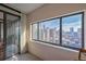Living room with expansive windows offering stunning city views at 1551 Larimer St # 2805, Denver, CO 80202