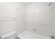 Clean and bright bathroom with a bathtub and white tile at 4333 S Andes Way # 203, Aurora, CO 80015