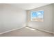 Bedroom with natural lighting, neutral paint, carpet, and views of a field; window view at 48250 Shetland Dr, Bennett, CO 80102