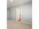 Bedroom featuring neutral carpeting and a view into the hallway with neutral paint at 48250 Shetland Dr, Bennett, CO 80102