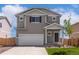 Charming two-story home with a two-car garage and a well-maintained front lawn and beautiful curb appeal at 48250 Shetland Dr, Bennett, CO 80102