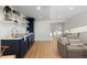 Modern basement kitchen with navy cabinets, floating shelves, and stainless steel appliances at 817 29Th St, Denver, CO 80205