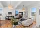 Light-filled living room with hardwood floors, comfortable seating, and a stylish coffee table at 817 29Th St, Denver, CO 80205