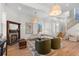 Bright living room with a decorative fireplace, modern lighting, and wood staircase at 817 29Th St, Denver, CO 80205