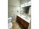 Double vanity bathroom with a large mirror and tile floor at 17443 Nature Walk Trail # 102, Parker, CO 80134