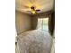 Bedroom with ceiling fan, carpet, and private balcony at 17443 Nature Walk Trail # 102, Parker, CO 80134