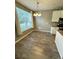 Dining area with gray vinyl plank flooring and large window at 17443 Nature Walk Trail # 102, Parker, CO 80134