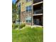 Exterior view of building with landscaping and lawn at 17443 Nature Walk Trail # 102, Parker, CO 80134