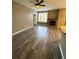 Spacious living room with fireplace and wood-look floors at 17443 Nature Walk Trail # 102, Parker, CO 80134