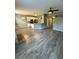 Living room with gray vinyl plank flooring and fireplace at 17443 Nature Walk Trail # 102, Parker, CO 80134