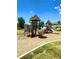 playground with wooden structures, slides, and climbing features at 17443 Nature Walk Trail # 102, Parker, CO 80134