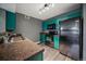 Modern kitchen featuring dark cabinets, stainless steel appliances, and sleek countertops, perfect for cooking and entertaining at 12931 Ironstone Way # 303, Parker, CO 80134