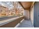 Balcony view with wooden railings looking out to a condo community at 1074 S Dearborn St # 108, Aurora, CO 80012