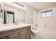 Bathroom with a shower-tub combination, large mirror, and light-toned vanity with storage at 1074 S Dearborn St # 108, Aurora, CO 80012