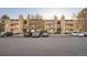 Comfortable apartment building featuring stone accent columns and private balconies at 1074 S Dearborn St # 108, Aurora, CO 80012