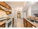 Well-lit kitchen with matching appliances, a double sink, and wooden countertops at 1074 S Dearborn St # 108, Aurora, CO 80012