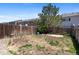 Backyard features a wood fence, potential for landscaping and outdoor enjoyment at 11050 Gaylord St, Northglenn, CO 80233