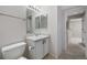 Bathroom features updated vanity, neutral decor and tiled floors at 11050 Gaylord St, Northglenn, CO 80233