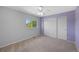 Bedroom with carpet floors, large window and ample closet space at 11050 Gaylord St, Northglenn, CO 80233