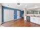Modern kitchen features hardwood floors and plenty of storage with access to other rooms at 11050 Gaylord St, Northglenn, CO 80233