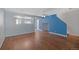 Open-concept living area featuring hardwood floors and seamless transition to the adjacent spaces at 11050 Gaylord St, Northglenn, CO 80233