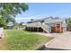 Expansive backyard with a large deck and a well-manicured lawn at 4381 Dixon Dr, Westminster, CO 80031