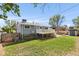 Well-maintained backyard with lush lawn, deck, and privacy fence at 4381 Dixon Dr, Westminster, CO 80031