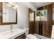 Stylish bathroom with modern fixtures, tiled shower, and natural light from the window at 4381 Dixon Dr, Westminster, CO 80031