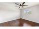 An empty bedroom features hardwood floors and natural light at 4381 Dixon Dr, Westminster, CO 80031