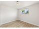 Bright bedroom features a large window offering pleasant outdoor views and ample natural light at 4381 Dixon Dr, Westminster, CO 80031
