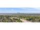 Expansive view of a city skyline, green trees, and a busy highway at 4381 Dixon Dr, Westminster, CO 80031