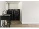 Convenient laundry room features sleek, high-efficiency washer and dryer units at 4381 Dixon Dr, Westminster, CO 80031