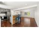Bright living area with wood floors, breakfast bar, and access to kitchen at 4381 Dixon Dr, Westminster, CO 80031