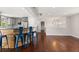 Spacious living room with wood floors, breakfast bar, and ample natural light at 4381 Dixon Dr, Westminster, CO 80031