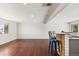 Large living room with wood floors, recessed lighting, and a view of the backyard at 4381 Dixon Dr, Westminster, CO 80031
