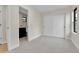 Bedroom featuring a closet with sliding doors and adjacent bathroom entrance at 2162 S Ash St, Denver, CO 80222