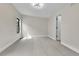 A view of the empty bedroom showing the overhead lighting and black-framed window at 2162 S Ash St, Denver, CO 80222
