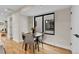 Cozy dining area featuring modern table set, hardwood floors, and natural lighting at 2162 S Ash St, Denver, CO 80222