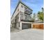 Three-story home featuring private balconies above a garage and driveway at 2162 S Ash St, Denver, CO 80222