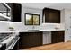 Sleek kitchen design with dark wood cabinetry, stainless steel appliances, and quartz countertops at 2162 S Ash St, Denver, CO 80222