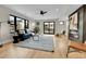 Bright living room with hardwood floors, modern fireplace, and a walkout to balcony at 2162 S Ash St, Denver, CO 80222