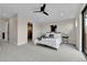 Spacious bedroom with neutral walls, carpet, modern decor, and an ensuite bathroom with a glass door at 2162 S Ash St, Denver, CO 80222