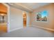 View of a bedroom with large window and walk-in closet at 18720 Lake Dr, Monument, CO 80132