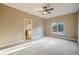 Bedroom with carpet flooring, neutral walls, and a view of the outdoors at 18720 Lake Dr, Monument, CO 80132